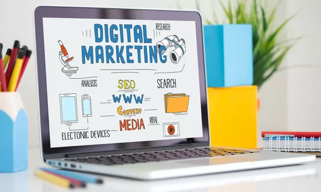 Laptop showing digital marketing strategy diagram with terms like SEO, content media, search, research, analysis, and electronic devices